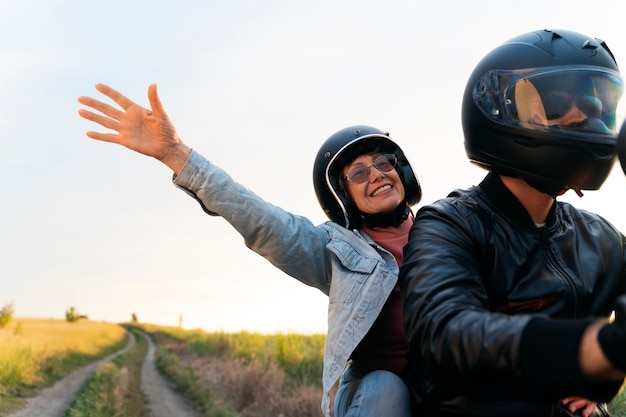 couple-riding-motorbike-around-beautiful-landscape_52683-127230