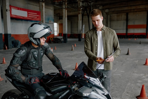 first-driving-lesson-motorcycle-school-indoor-motordrome_266732-43842