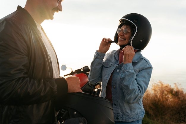 side-view-people-with-motorbike-outdoors_23-2150620966